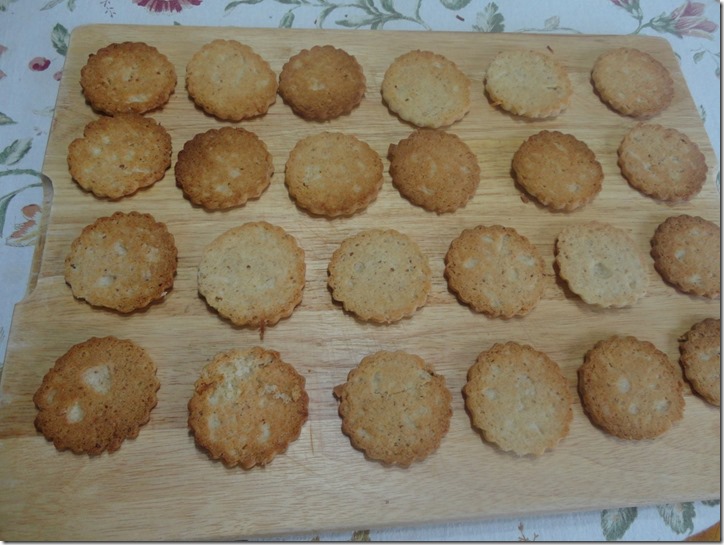 cookies prepared to receive sweet milk and coconut