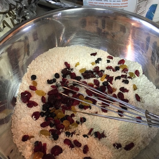 mixing gluten free dry ingredients with dried fruit