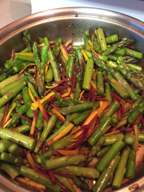 cooking asparagus and carrots in a large skillet