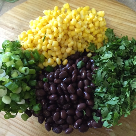 fresh ingredients for Stuffed Sweet Potato with Chipotle Black Bean and Corn Salad
