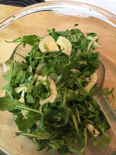 Arugala and Fennel in a salad bowl with dressing