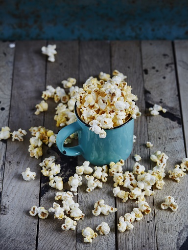 Mint cup full of popcorn -  National Popcorn Day 2016